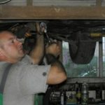 Car mechanic working on engine in Pinellas FL