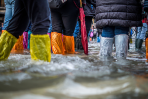 people standing in flooded waters