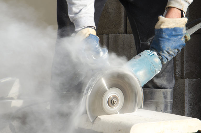 Person cutting stone is exposed to crystalline silica
