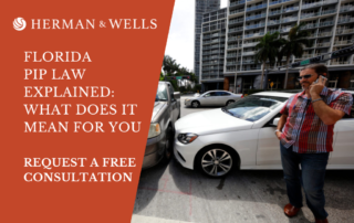 Vehicle collision between a car and truck on Brickell Avenue and 5th Street in Miami. Man on the phone with his personal injury lawyer talking about personal injury protection (PIP).