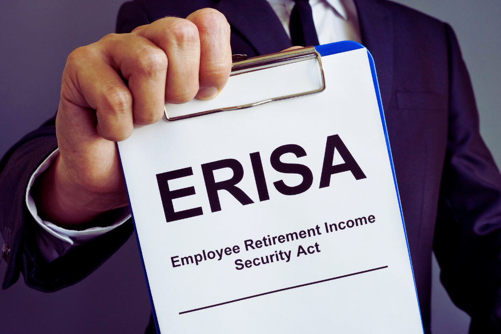 holding out a clipboard with ERISA acronym and description